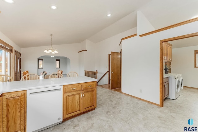 kitchen with vaulted ceiling, pendant lighting, dishwasher, and light countertops