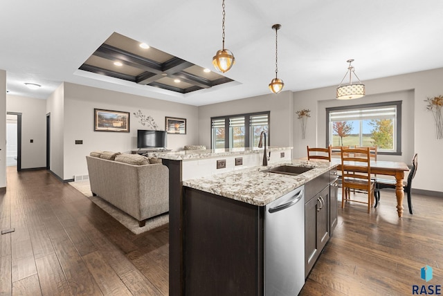 kitchen featuring coffered ceiling, an island with sink, stainless steel dishwasher, pendant lighting, and a sink