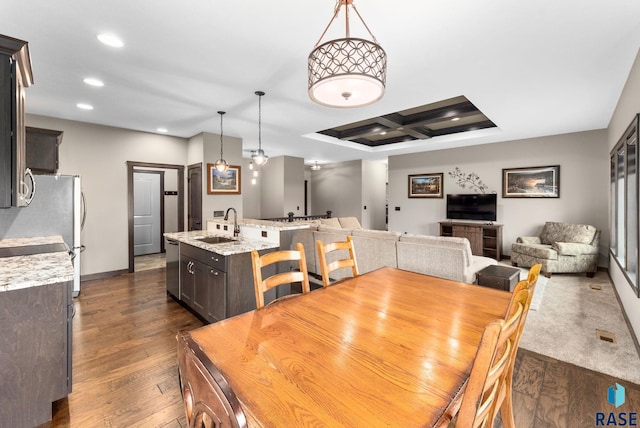 dining room with dark wood-style floors, recessed lighting, coffered ceiling, and baseboards