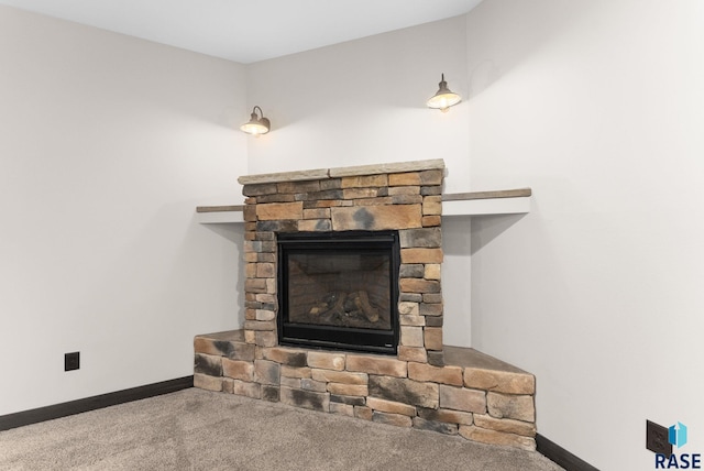 interior details with carpet flooring, a fireplace, and baseboards