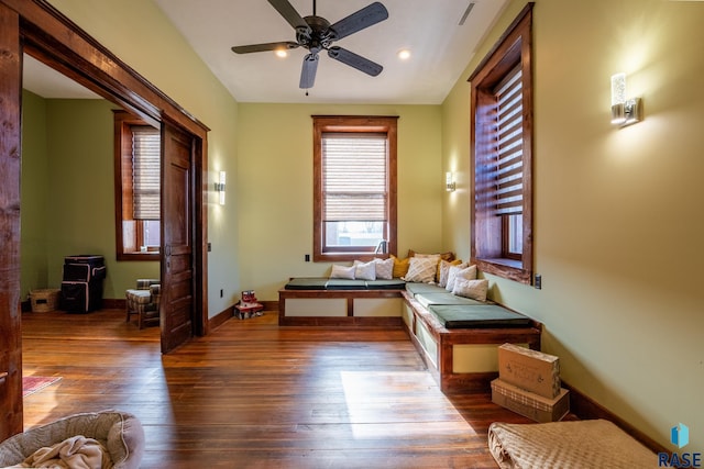 interior space with recessed lighting, ceiling fan, baseboards, and wood finished floors