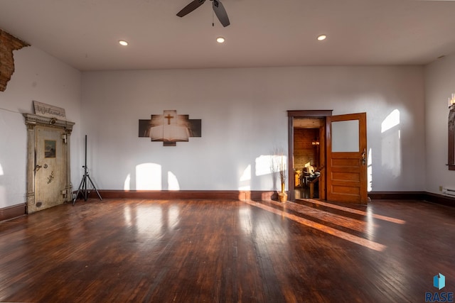 unfurnished living room with ceiling fan, baseboards, dark wood finished floors, and recessed lighting