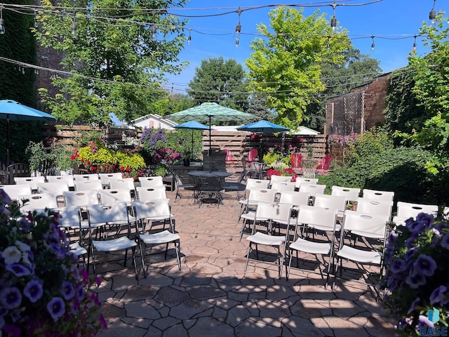 view of patio / terrace with outdoor dining area and fence