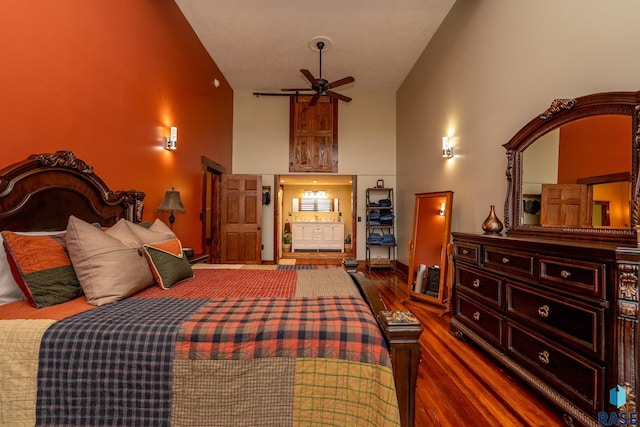 bedroom featuring high vaulted ceiling and dark wood-type flooring