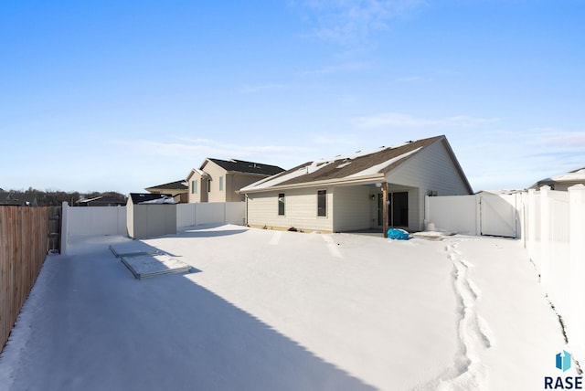 view of side of home featuring fence