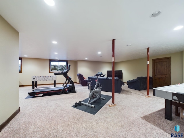 workout room featuring recessed lighting, light carpet, and baseboards