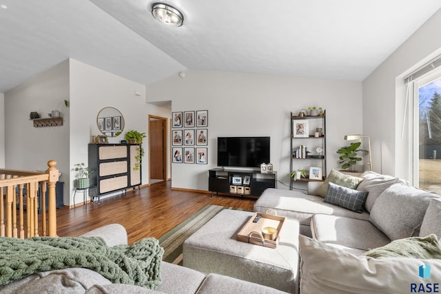 living area with dark wood-style floors and lofted ceiling