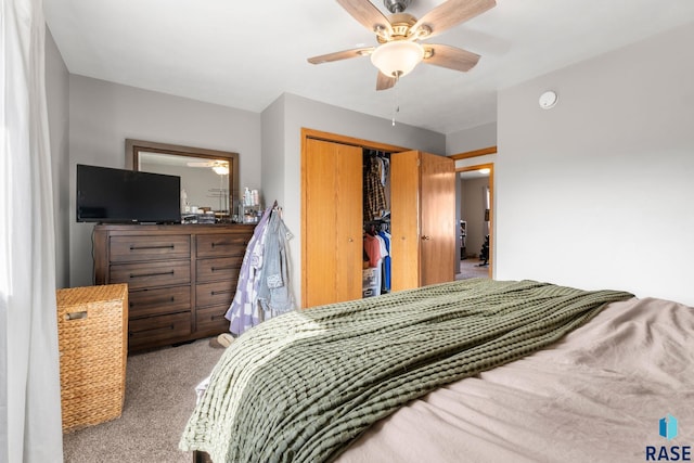 bedroom featuring a closet, light carpet, and ceiling fan