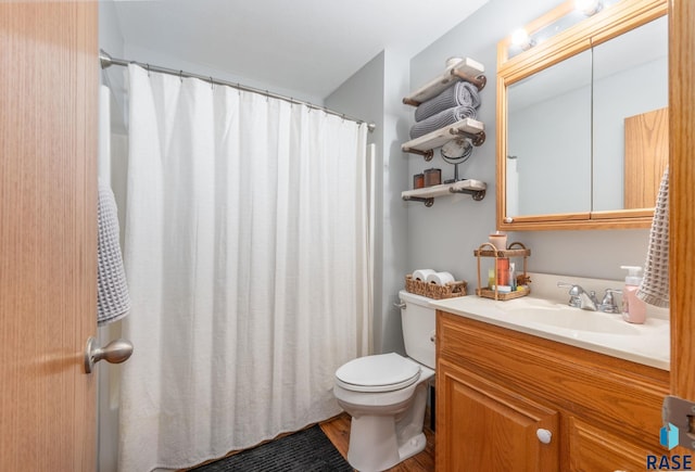 full bath with vanity and toilet