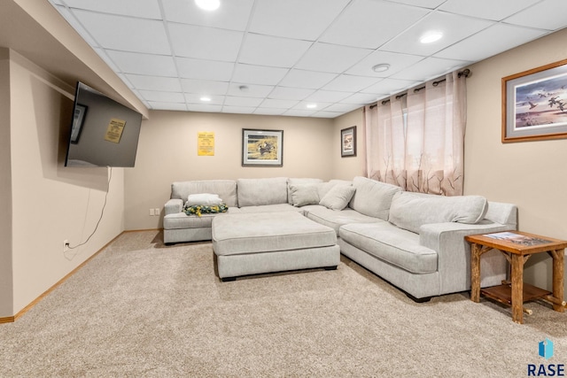 living room with light carpet, baseboards, a drop ceiling, and recessed lighting