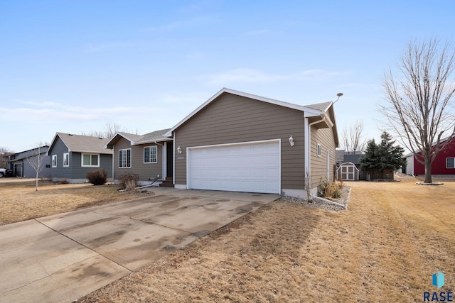 ranch-style house with a storage shed, driveway, an attached garage, and an outdoor structure