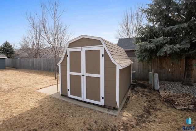 view of shed with a fenced backyard