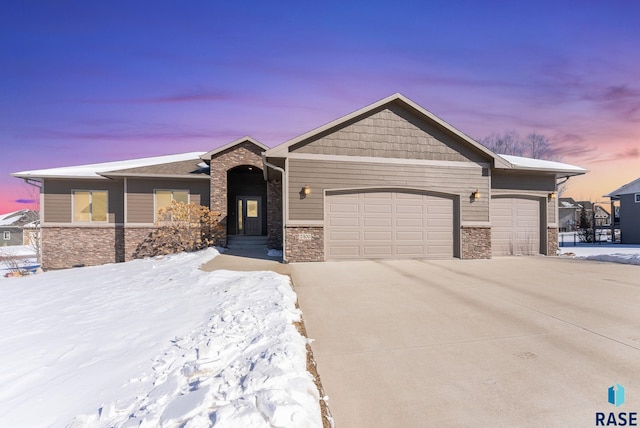 view of front of property with a garage and concrete driveway