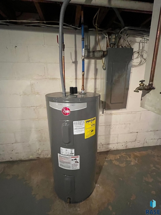 utility room with electric panel and electric water heater