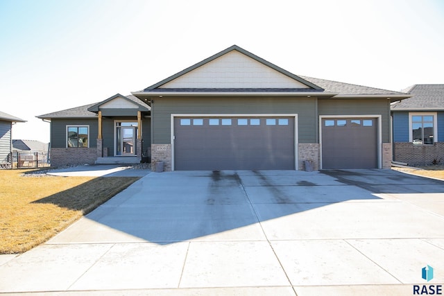 view of front facade with driveway and an attached garage