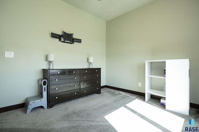 carpeted bedroom featuring baseboards