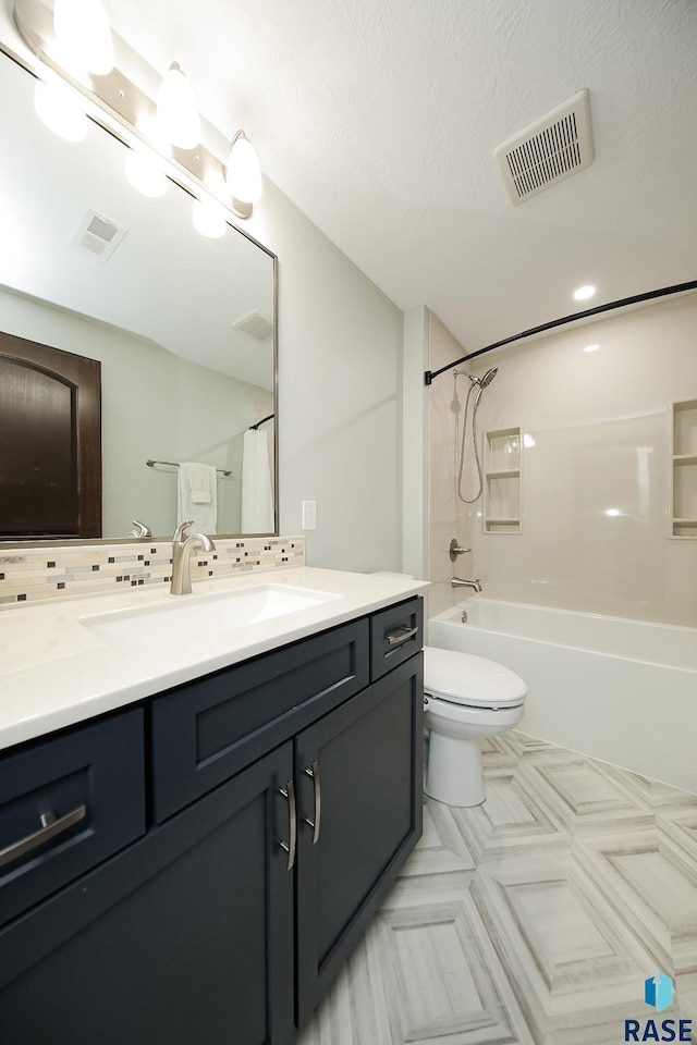 full bath featuring  shower combination, visible vents, vanity, and decorative backsplash