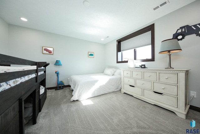 carpeted bedroom with recessed lighting, visible vents, and baseboards