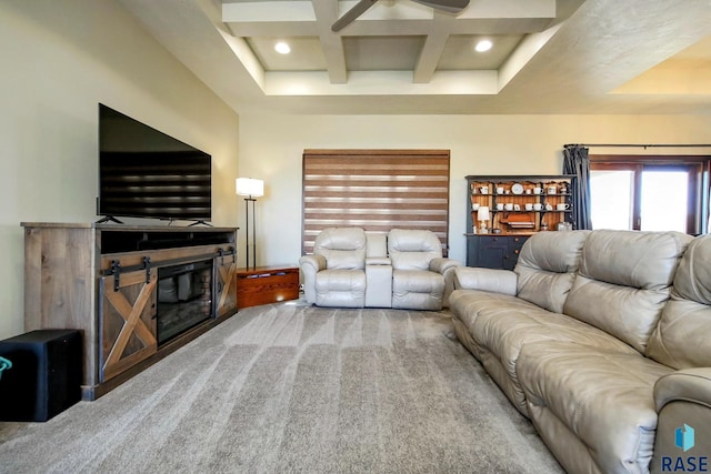 carpeted living area with coffered ceiling, a glass covered fireplace, beam ceiling, and recessed lighting