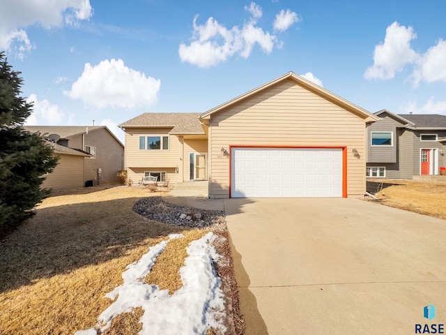 view of front of home with a garage and driveway