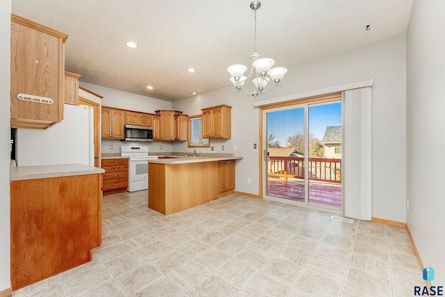 kitchen with light countertops, hanging light fixtures, a sink, white appliances, and a peninsula