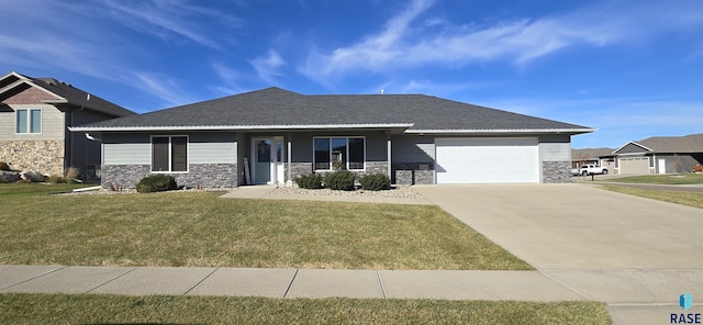 view of front of home with a garage, stone siding, a front lawn, and driveway