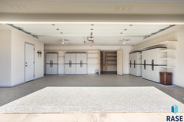 garage with a garage door opener and freestanding refrigerator