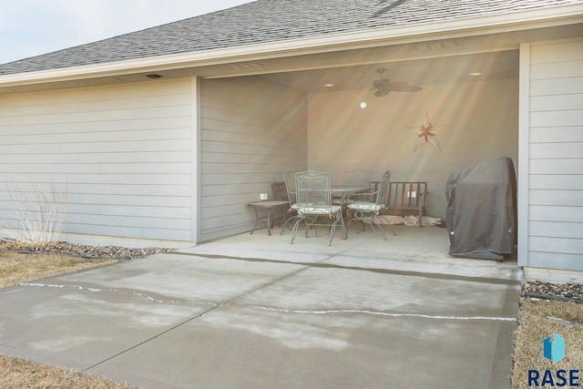 view of patio featuring ceiling fan, a grill, and outdoor dining area