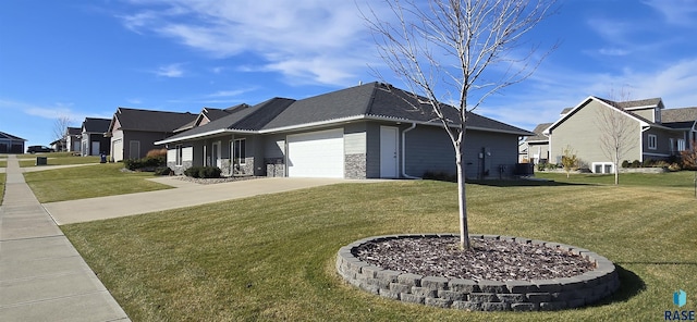 view of side of property featuring concrete driveway, a lawn, a garage, a residential view, and stone siding