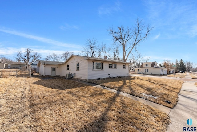 single story home featuring crawl space, a chimney, and cooling unit