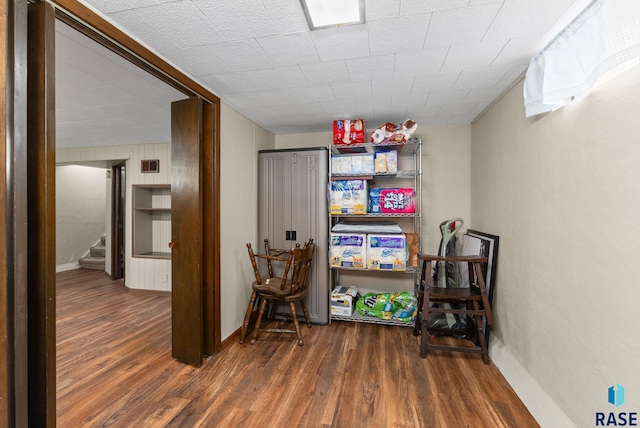 interior space with dark wood finished floors and baseboards