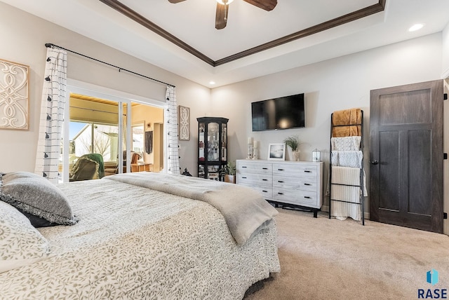 bedroom featuring ceiling fan, recessed lighting, light colored carpet, a tray ceiling, and crown molding