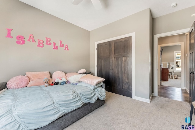 bedroom featuring carpet, a closet, ceiling fan, and baseboards