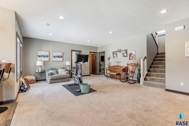 living room featuring recessed lighting, light colored carpet, and stairway