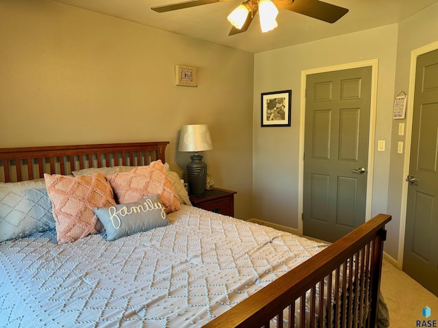 bedroom featuring ceiling fan, carpet floors, and baseboards