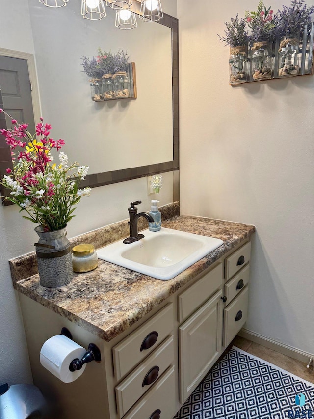 bathroom featuring tile patterned flooring and vanity