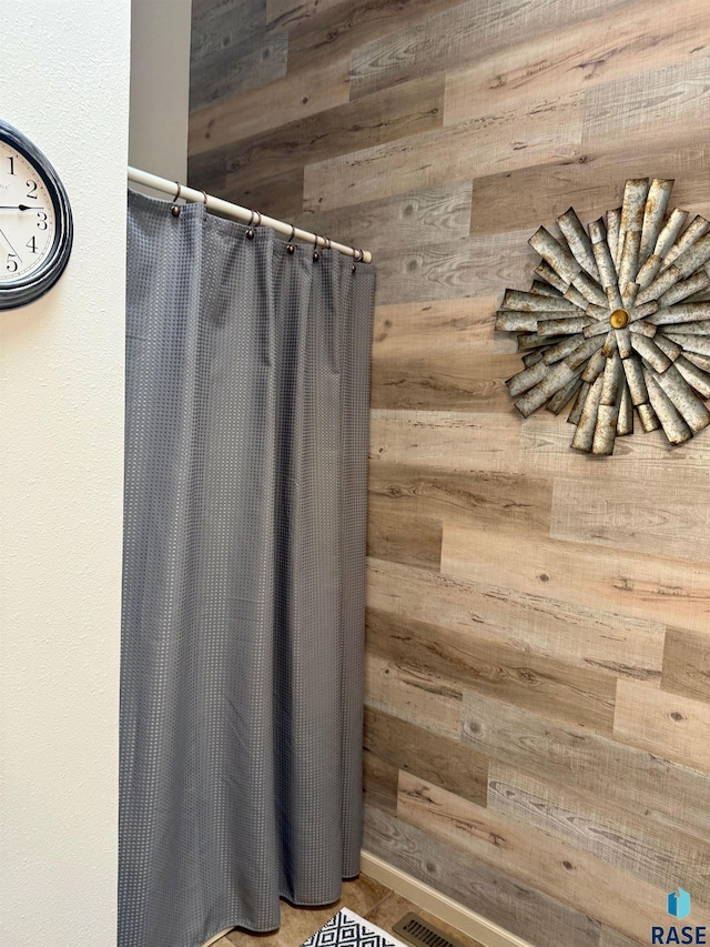 bathroom with wooden walls