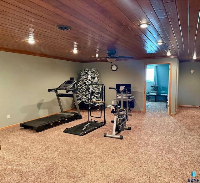 workout area with carpet, wood ceiling, and baseboards