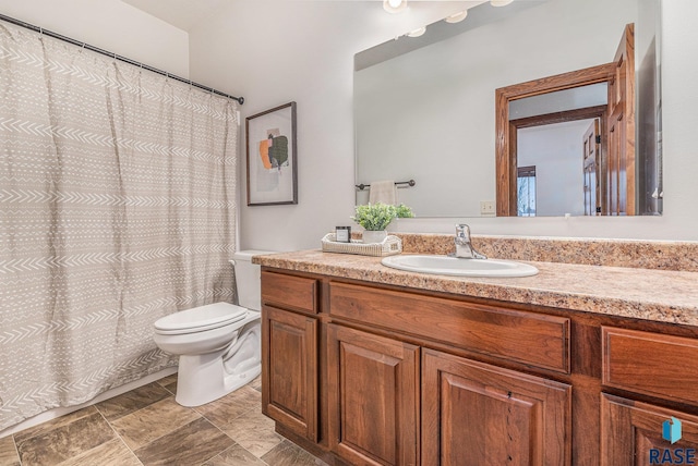 bathroom with toilet and vanity