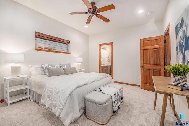 bedroom featuring recessed lighting, baseboards, ensuite bathroom, and light colored carpet