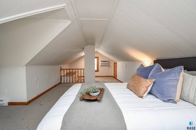 carpeted bedroom featuring lofted ceiling, baseboards, and a wall mounted air conditioner