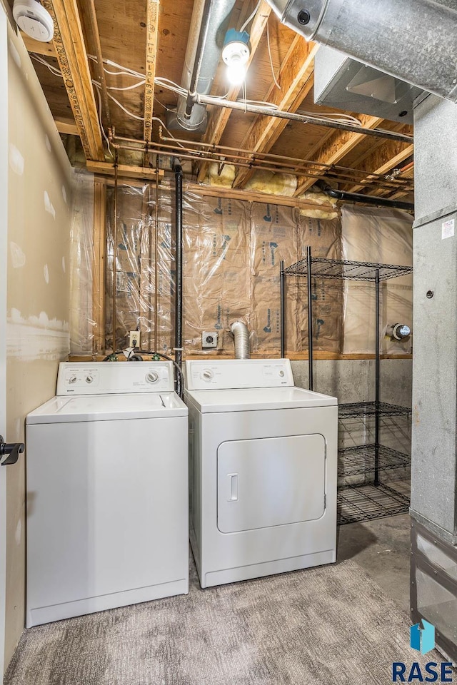 laundry room featuring laundry area and washer and clothes dryer