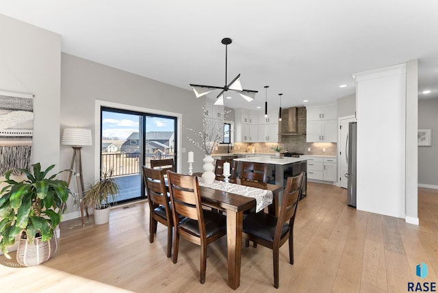 dining area featuring light wood-type flooring, visible vents, baseboards, and recessed lighting