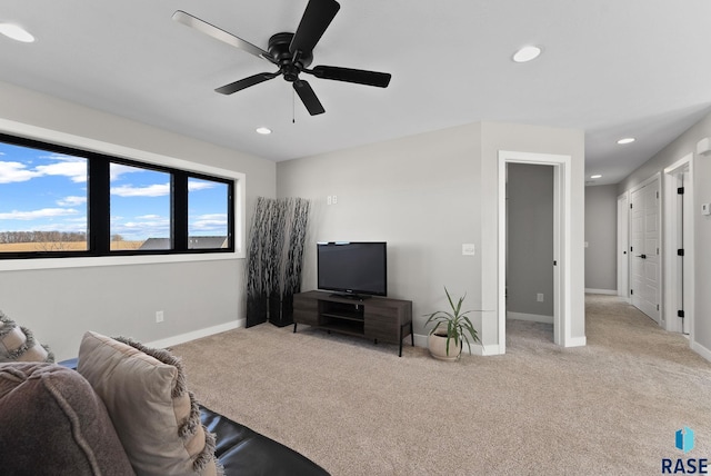 living area with a ceiling fan, baseboards, carpet flooring, and recessed lighting