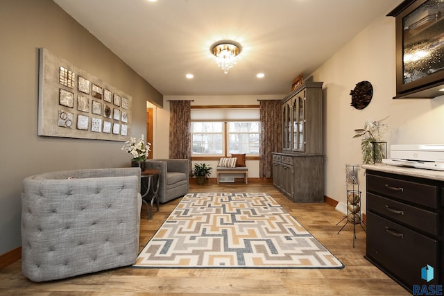 sitting room featuring recessed lighting, baseboards, and wood finished floors