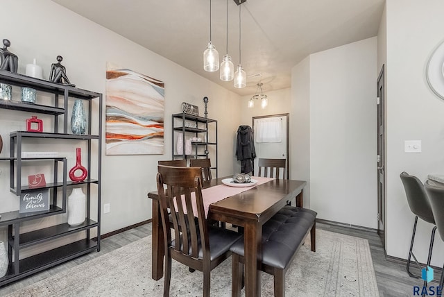 dining room with wood finished floors and baseboards