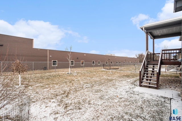 view of yard featuring stairs and fence