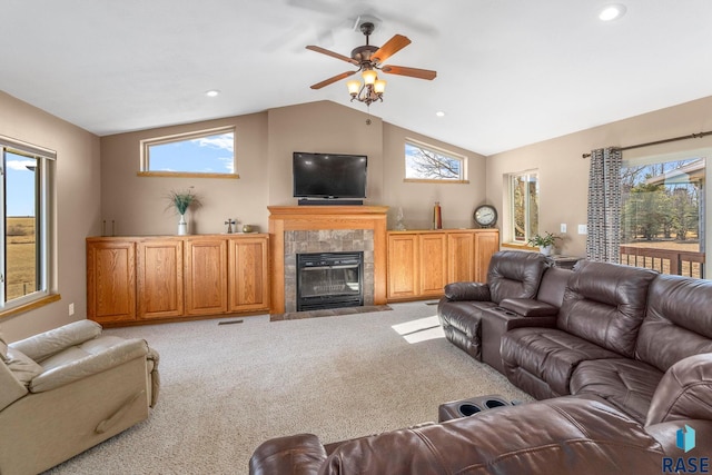 living room with lofted ceiling, ceiling fan, recessed lighting, a fireplace, and carpet