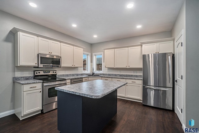 kitchen featuring white cabinetry, stainless steel appliances, and a sink