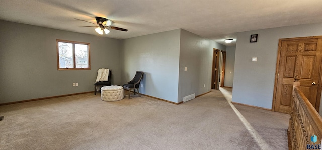 interior space with light carpet and baseboards